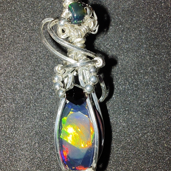 Sterling silver wire wrapped genuine black faceted Ethiopian opal pendant - Picture 3 of 9